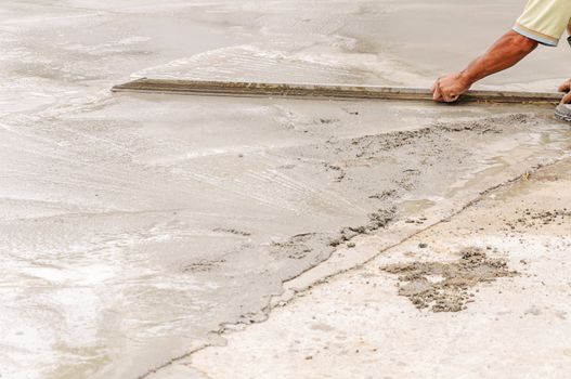 Worker decorative concrete slab smooth.