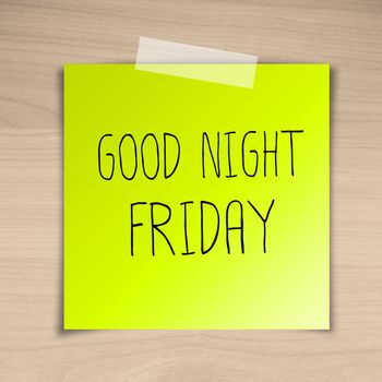 Good night friday sticky paper on brown wood background texture