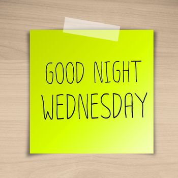 Good night wednesday sticky paper on brown wood background texture