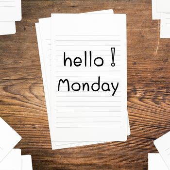 Hello Monday on paper and wood table desk