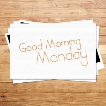 Good Morning Monday on paper and Brown wood plank background