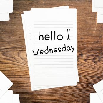 Hello Wednesday on paper and wood table desk