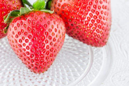 Organic Strawberry fruits nature on the glass dish