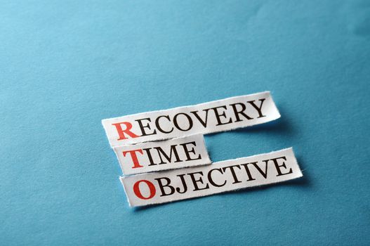 RTO acronym  - Recovery Time Management , words on cut paper hard light