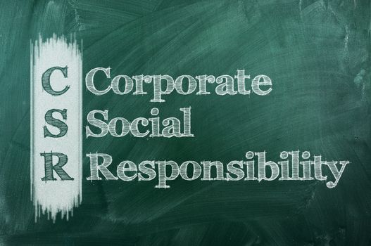  corporate social responsibility ( CSR ) concept on green  chalkboard 