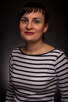 portrait of a stylish expressive woman in studio