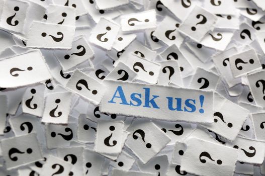 ask us question marks on white papers -hard light