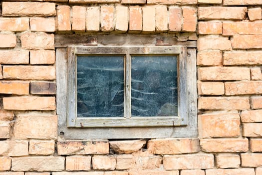 vintage, old brown wooden window on brick wall