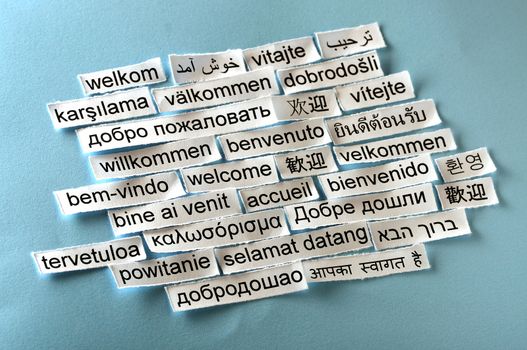 welcome  Word Cloud  printed on  paper on blue font