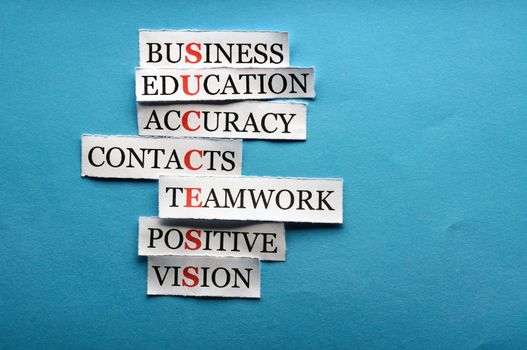 Success  acronym  in business concept, words on cut paper hard light