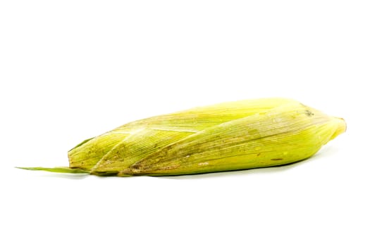 fresh corn fruits with green leaves on white background