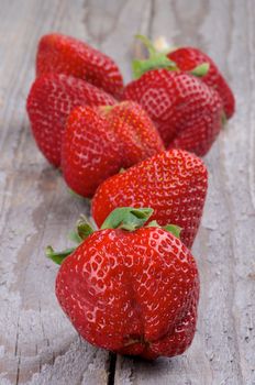Big Fresh Ripe Strawberries closeup on Rustic Wooden background