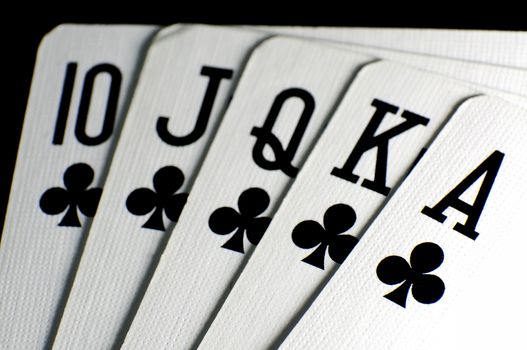 Poker cards - royal flush on clubs, close-up