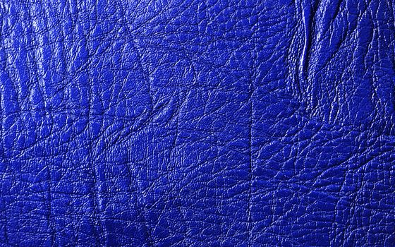 Blue vivid leather texture closeup, useful as background 