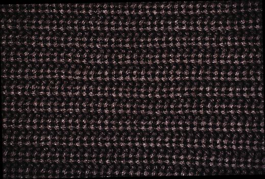 closeup of knitted dark  fabric texture 