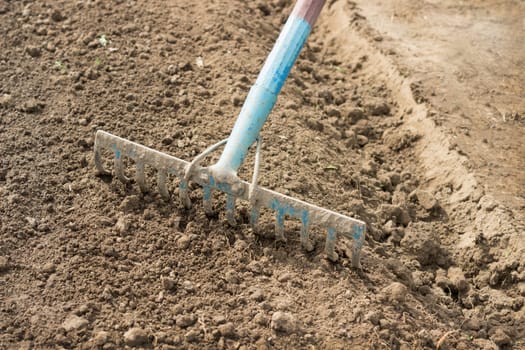 Rake harrow tillage before planting seeds in spring