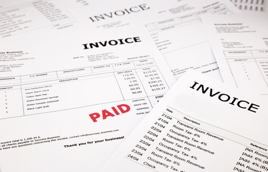 difference invoices and bills with red paid stamp, concept and ideas