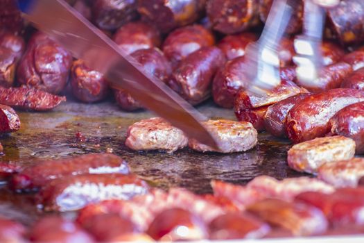 Grilled artisan sausages in a medieval fair