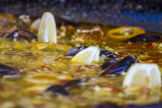 Saffron, traditional Spanish paella, seafood and rice dish made ������with wood fire