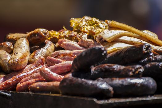 Grill, artisan sausages in a medieval fair