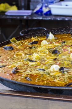 Valencia, traditional Spanish paella, seafood and rice dish made ������with wood fire