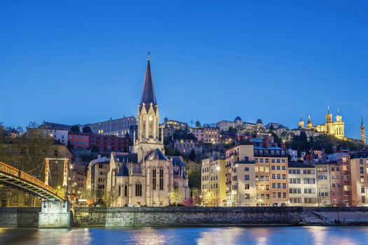 Famous Saint-Georges church in Lyon with Saone river at night 