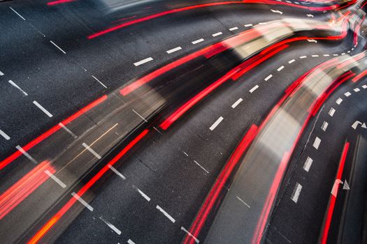 Motion blurred city road traffic (color toned  image)