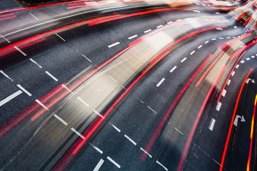 Motion blurred city road traffic (color toned  image)