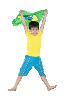 Brazilian Boy, jumping, holding a Brazilian flag.