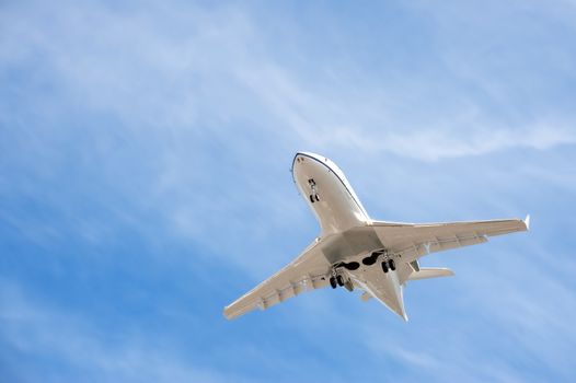 unmarked business jet on landing approach