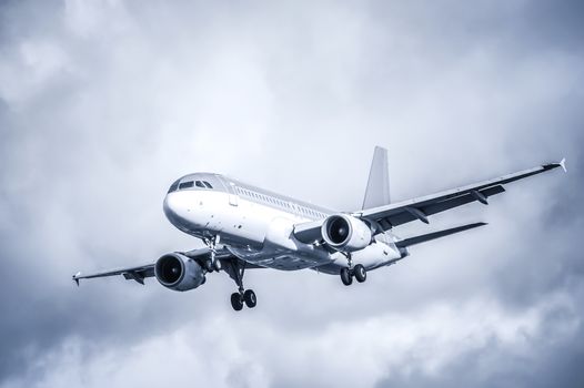 cool toned passenger aircraft landing in turbulence