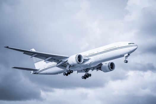 cool toned unmarked passenger aircraft landing