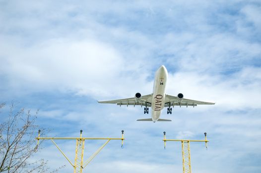 London, Heathrow, UK - April 9, 2010: Qatar Airways Airbus A330 on landing approach to Heathrow, Britains busiest international airport.