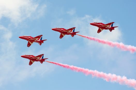 Farnborough, UK - July 15, 2010: Formation flying by part of the Red Arrows aerobatic display team during the Farnborough International Airshow, UK