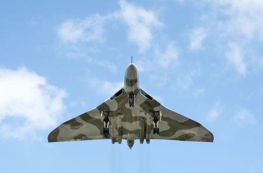 Farnborough, UK - July 16, 2010: Low level pass by the last surviving air-worthy Avro Vulcan Bomber during the Farnborough Airshow, UK