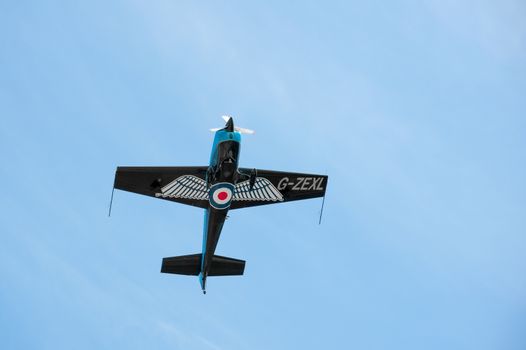 Farnborough, UK - July 19, 2010: Blades aerobatic display aircraft in a steep climb maneuver at the Farnborough Airshow, UK