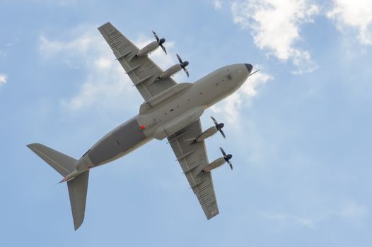 Farnborough, UK - July 21, 2010: Large Airbus A400M military transporter aircraft showing aerobatic capabilities at the Farnborough Airshow, UK