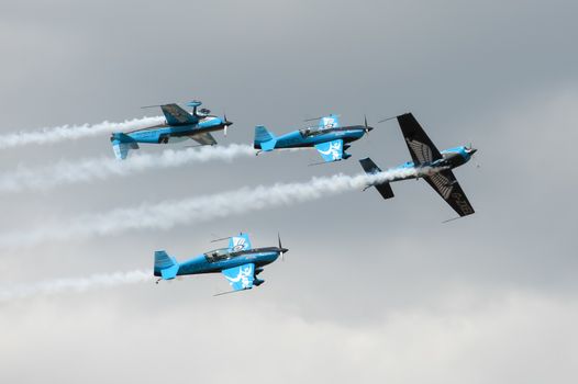 Farnborough, UK - July 24, 2010: The Blades formation aerobatics team performing a maneuver known as Crazy Flying.