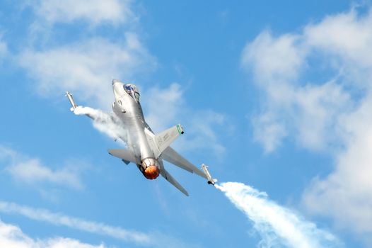 Farnborough, UK - July 24, 2010: USAF F-16 in a steep climb using reheat during the Farnborough Airshow, UK