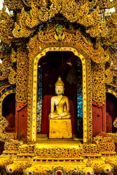 detail of wood carving with thai pattern on natural wood plate for decorated temple,Thailand