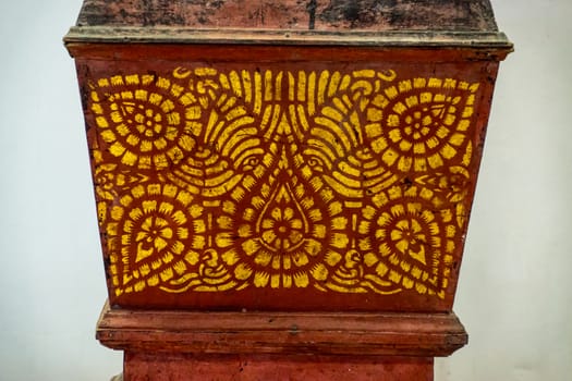 detail of thai pattern on ancient wooden casket