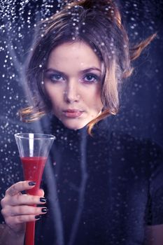 Sexy woman-portrait of a woman with a glass of red wine