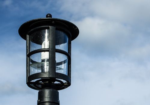 Lamp against the cloudy skies