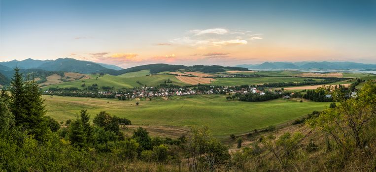 nature landscape with village and mountains, view towards west tatra and low tatra mountains