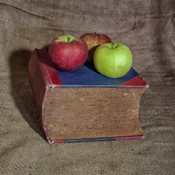 Apples on a old book 