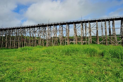 Wood bridge with river and mountain in Kanchanaburi Thailand