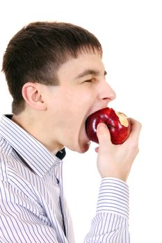 Hungry Teenager eats An Apple Isolated on the White Background