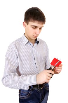 Teenager cutting a Credit Card Isolated on the White Background