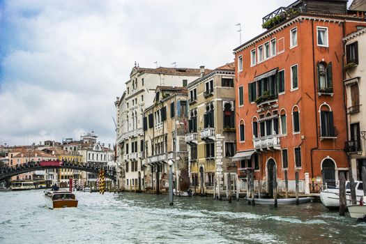 The Canal Grande in Venice, Italy with bridge in the back and various boats