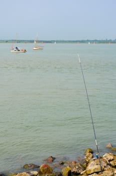 Sea fishing scene over estuary